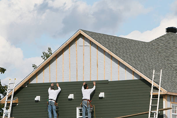 Professional Siding technician working in Castalia, OH